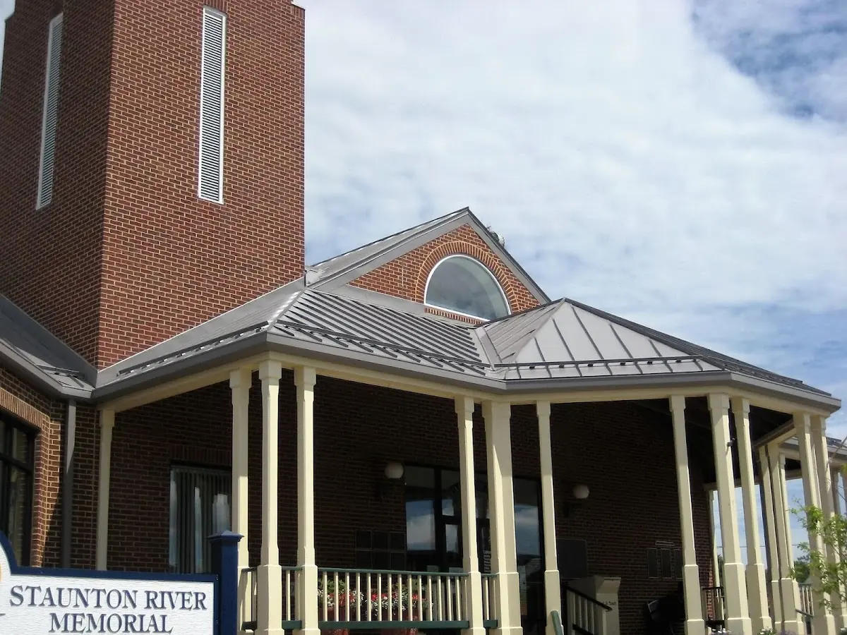 Skilled roofing craftsmen working on a residential roof in Roanoke